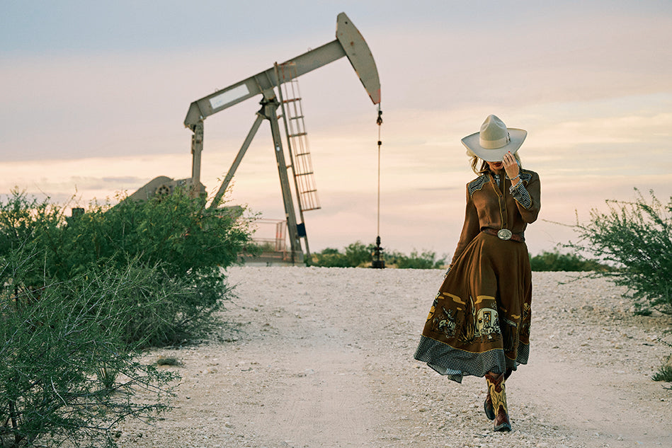 Haley wearing the Oil Camp Top and Skirt with the Eagle Ford Boots and Double D Ranch jewelry and accessories.