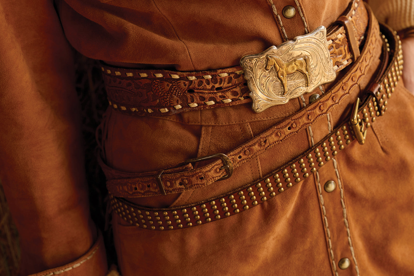 Layered vintage Double D Ranch Belts
