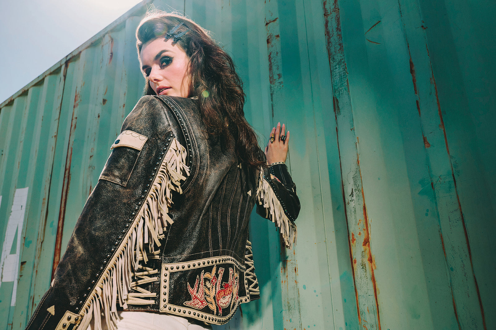 Kaylin wearing the High Stakes Jacket with Double D Ranch jewelry and accessories.