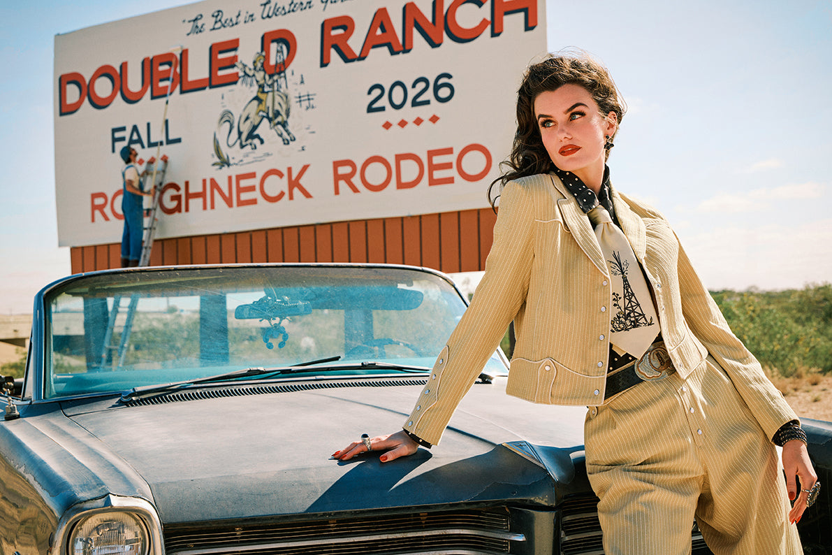 Kaylin wearing the Texas Timexes Jacket and Pant with the Spew Blouse and Oil Camp Tie.