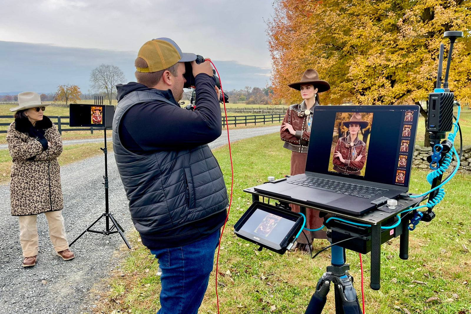 Cheryl watching Mitchell Shoot Kaylin wearing the Cowboy Gist Jacket and Skirt set on set at the Nu Rodeo photoshoot.