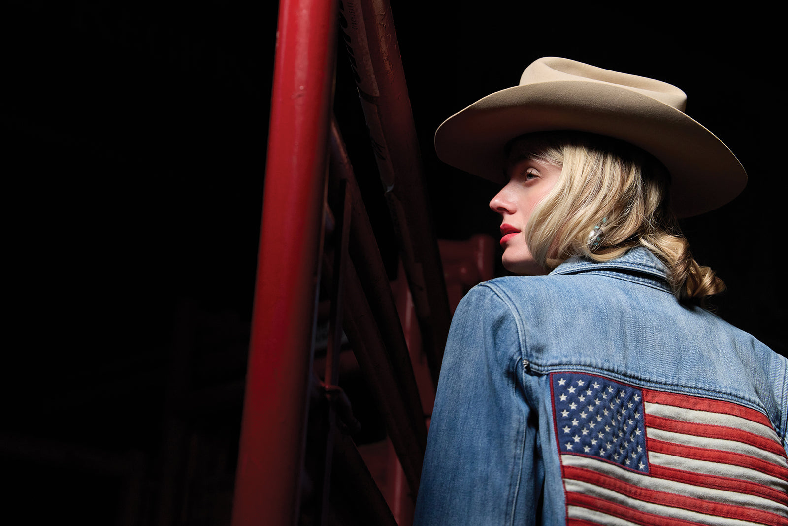 Haley wearing the Old Glory and Grit Jacket with a vintage Double D Ranch hat