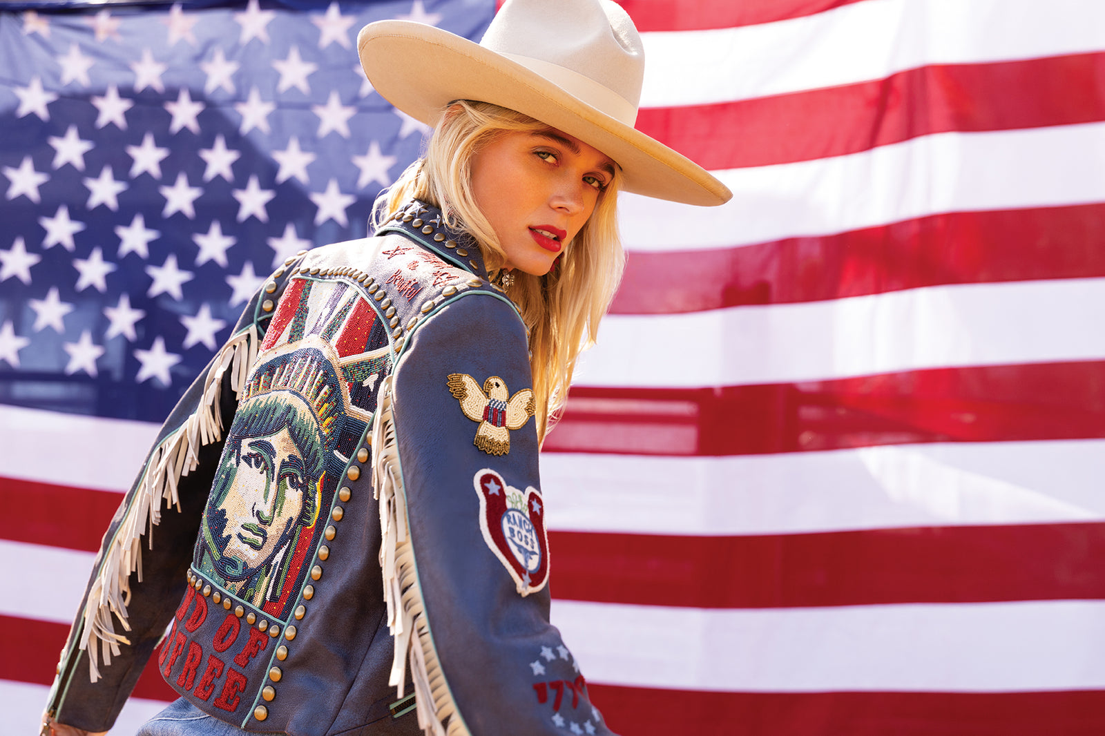 Haley wearing the Lady Liberty Biker Jacket with a vintage Double D Ranch hat.