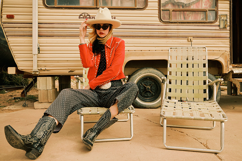 Lozzie wearing the Odessa Jacket with the Peggy Barrel Pant and the Texas Jack Boot in black with Double D Ranch accessories.