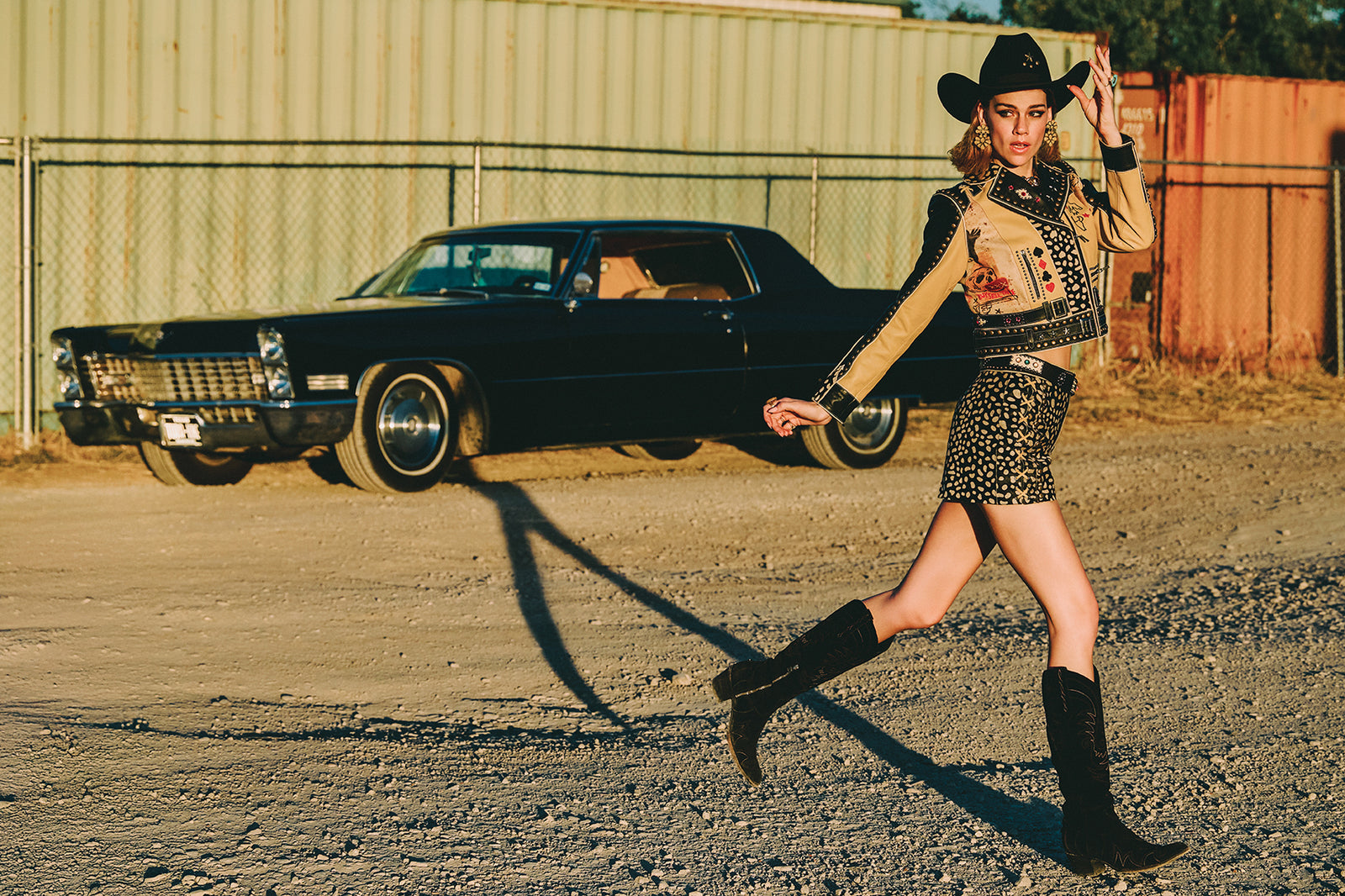Lozzie wearing the Cowboy Graffiti Jacket, Howdy Dotty Short, Long Tall Sally Boots, with Oscar Betz earrings and the City Slicker Hat.
