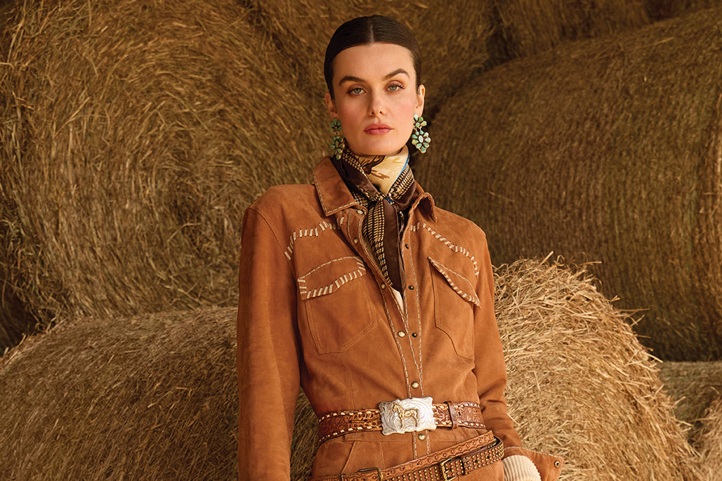 Kaylin wearing the Seafield Jumpsuit layered with the Bryce Henley and the Horistculture scarf paired with vintage Double D Ranch belts and stunning Oscar Betz earrings